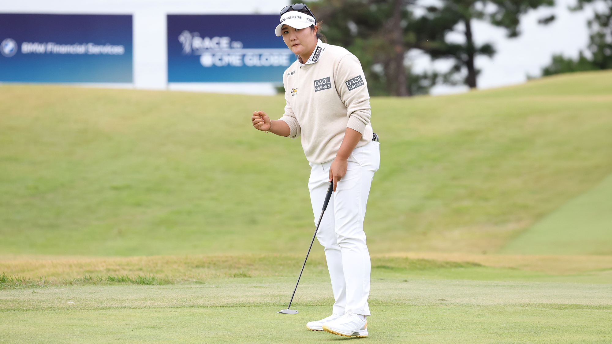 Haeran Ryu of South Korea reacts after sinking a putt for birdie to finish play on the 18th green during the second round of the BMW Ladies Championship 2026 at Pine Beach Golf Links on October 23, 2026 in Haenam, South Korea.