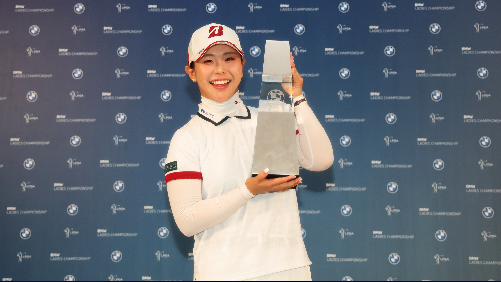 Yuri Yoshida of Japan celebrates with the winner's trophy following the final round of the BMW Ladies Championship 2026 at Pine Beach Golf Links on October 25, 2026 in Haenam, South Korea.