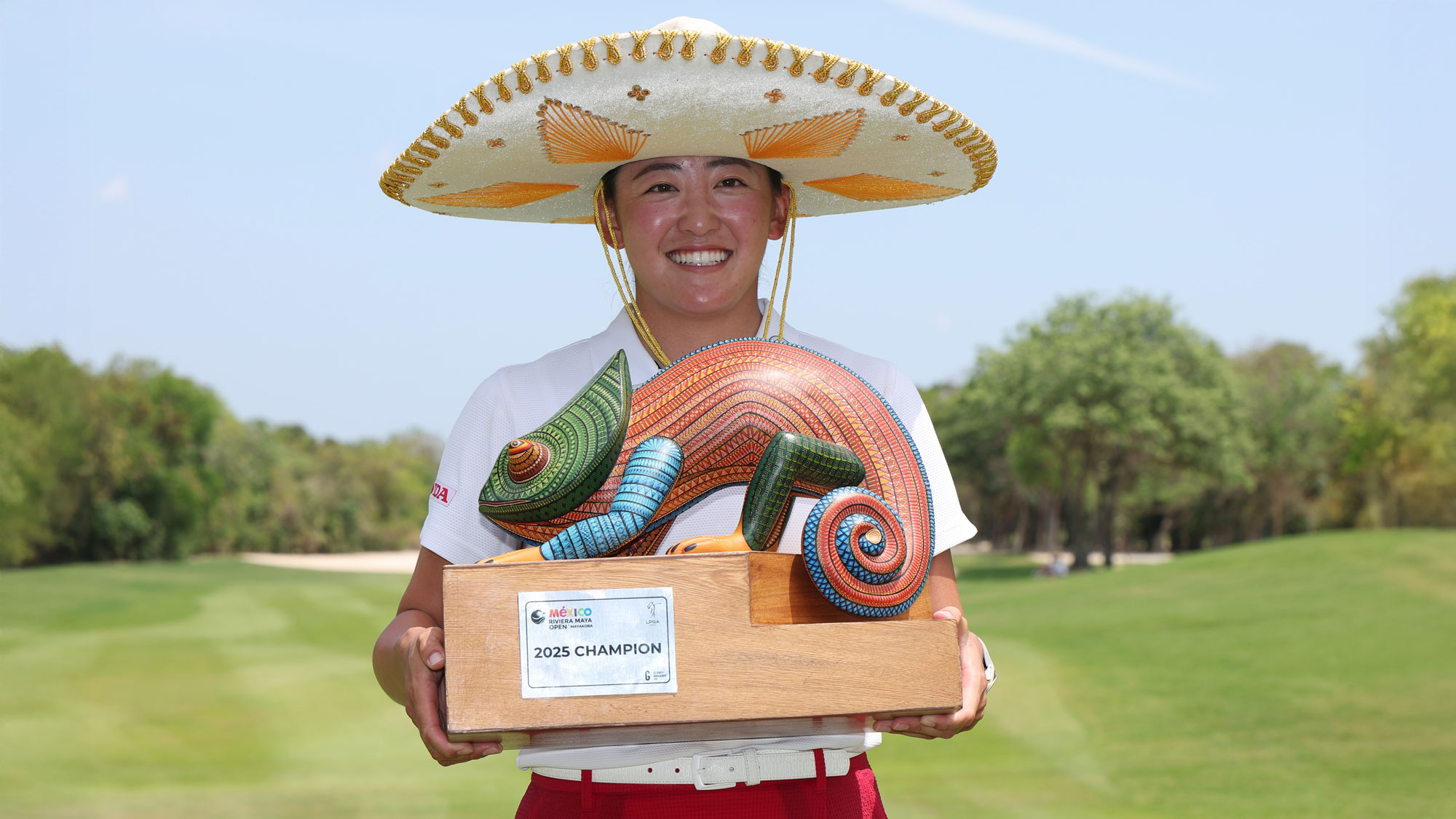Chisato Iwai of Japan poses with the trophy after the final round of the Riviera Maya Open at Mayakoba 2025 at El Camaleon at Mayakoba on May 25, 2025 in Playa del Carmen, Mexico.