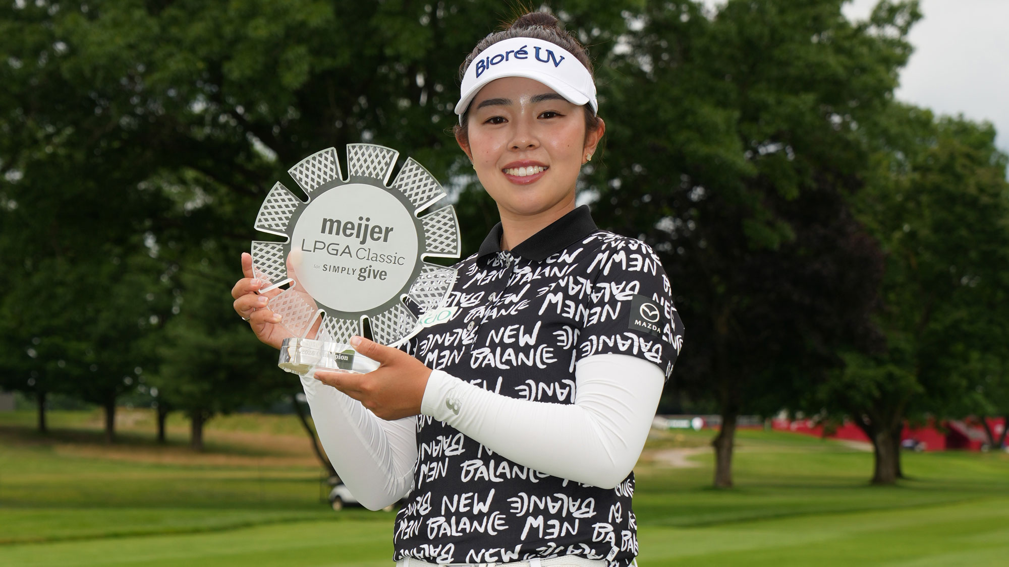 Miyu Yamashita of Japan poses with the trophy after winning the Meijer LPGA Classic For Simply Give 2026 at Blythefield Country Club on June 21, 2026 in Belmont, Michigan.