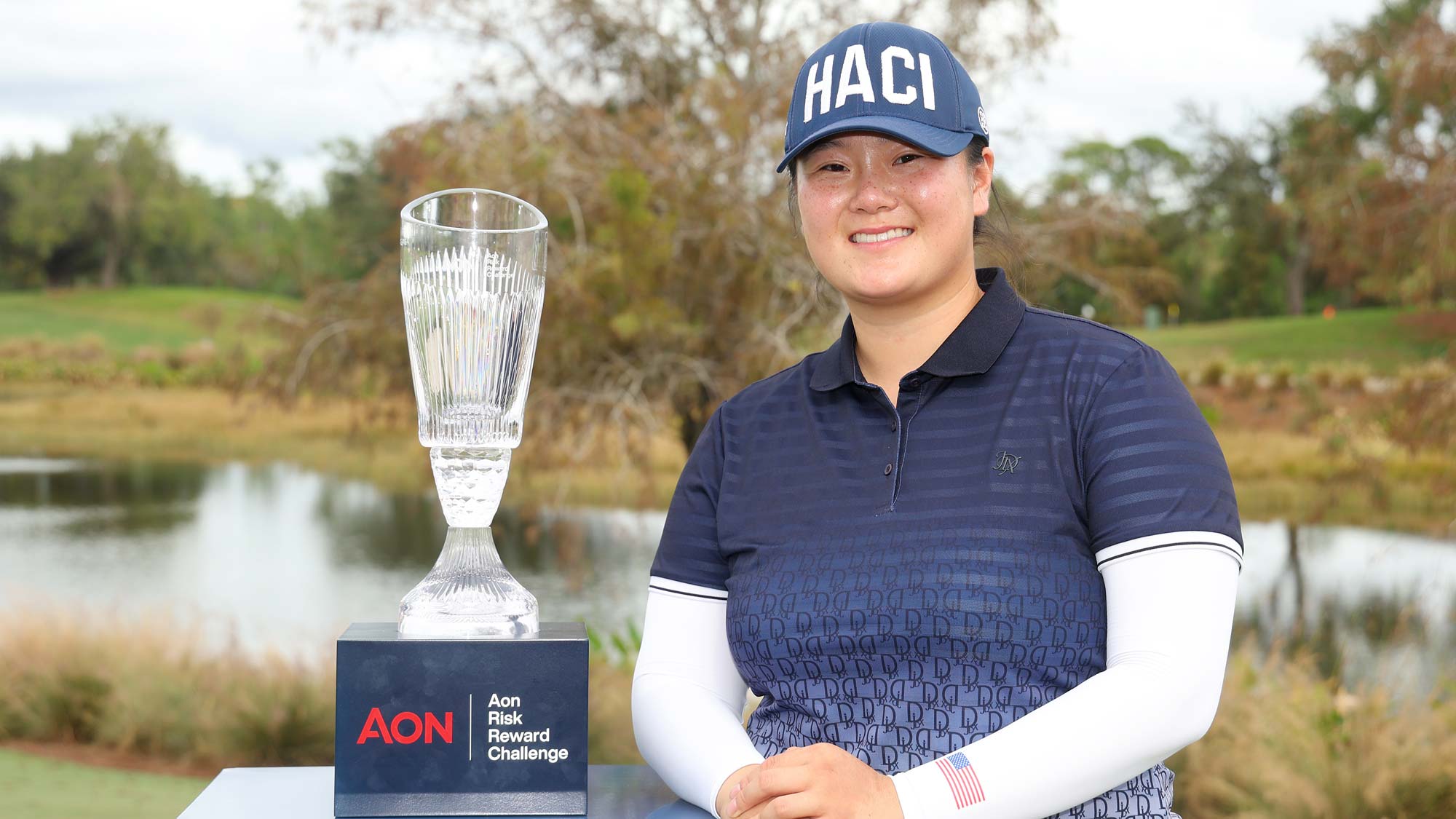 Angel Yin of the United States poses with the trophy after winning the 2023 AON Risk Reward Challenge