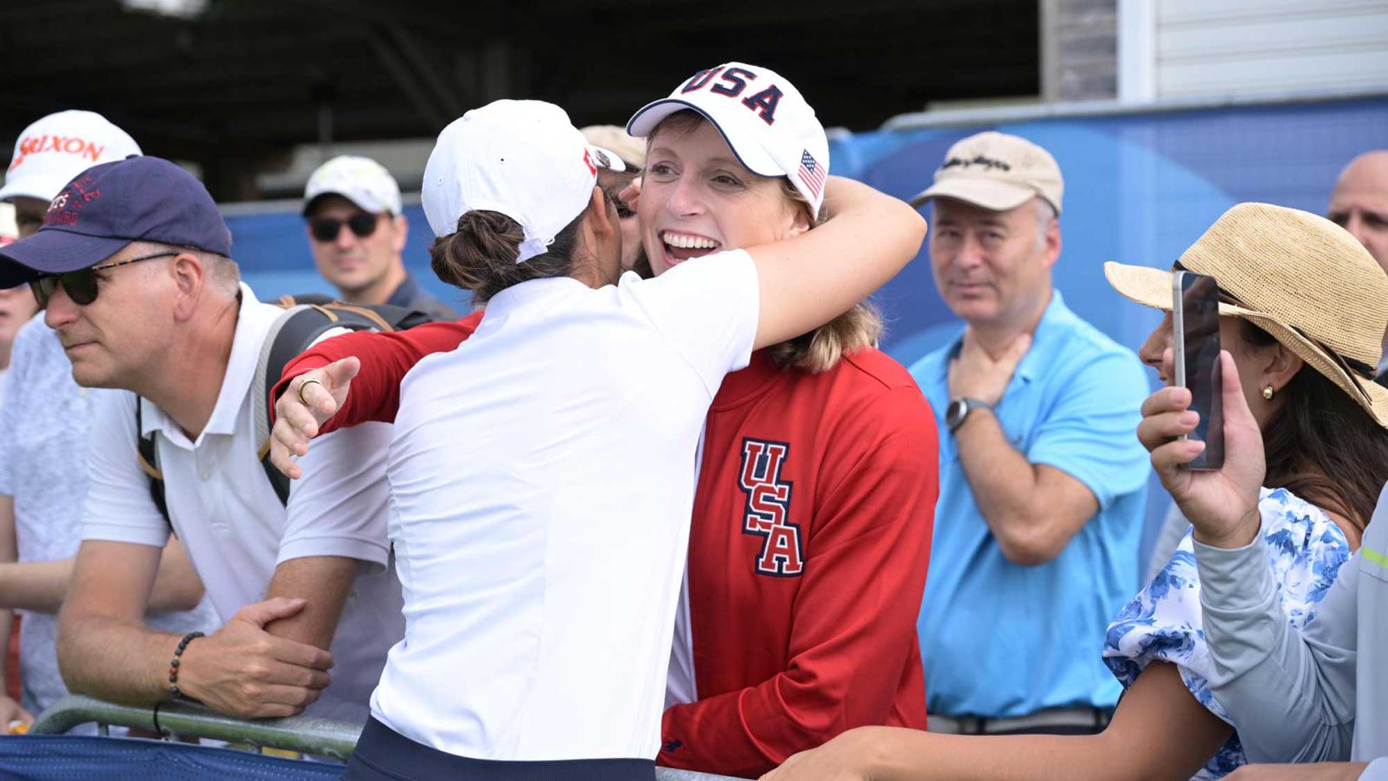 Albane Valenzuela hugs Katie Ledecky