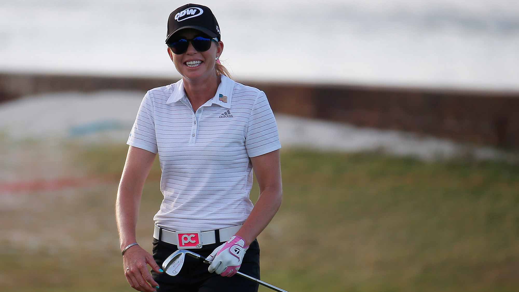 Paula Creamer reacts after she made an eagle on her second shot on the eighth hole during the first round of the Pure Silk Bahamas LPGA Classic at the Ocean Club Golf Course