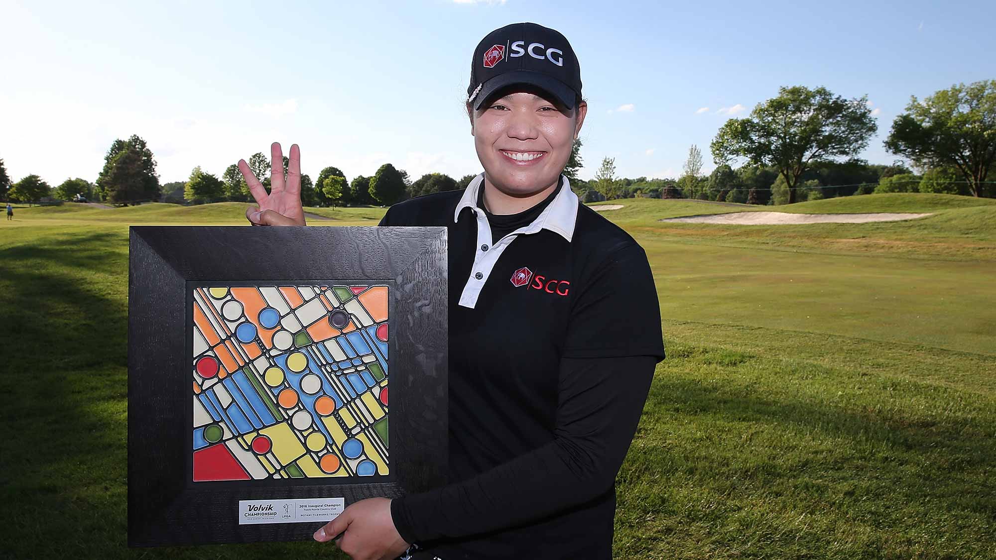 Ariya Jutanugarn from Thailand poses with the championship trophy after winning the LPGA Volvik Championship