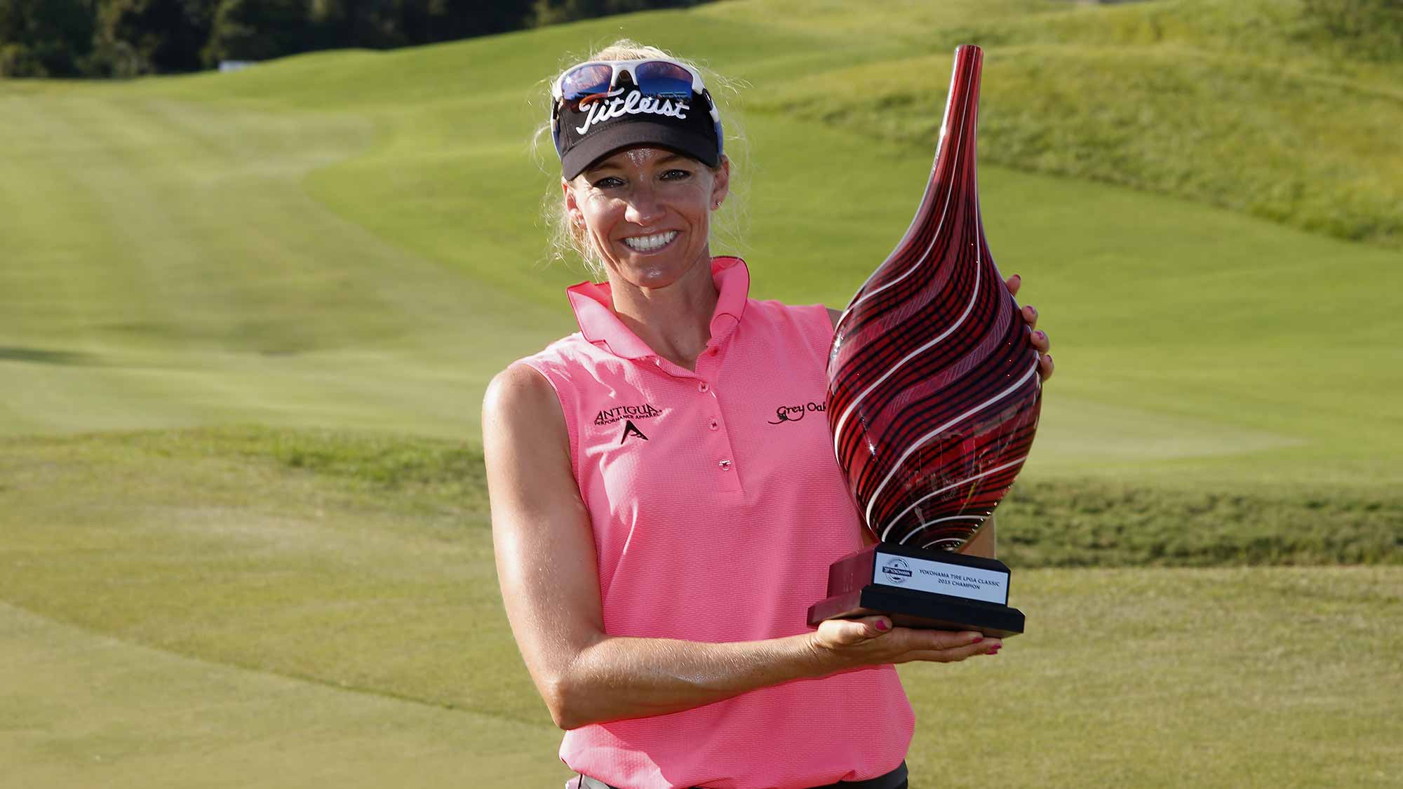 Kris Tamulis poses with the winner's trophy after winning the Yokohama Tire LPGA Classic at the Robert Trent Jones Golf Trail at Capitol Hill 