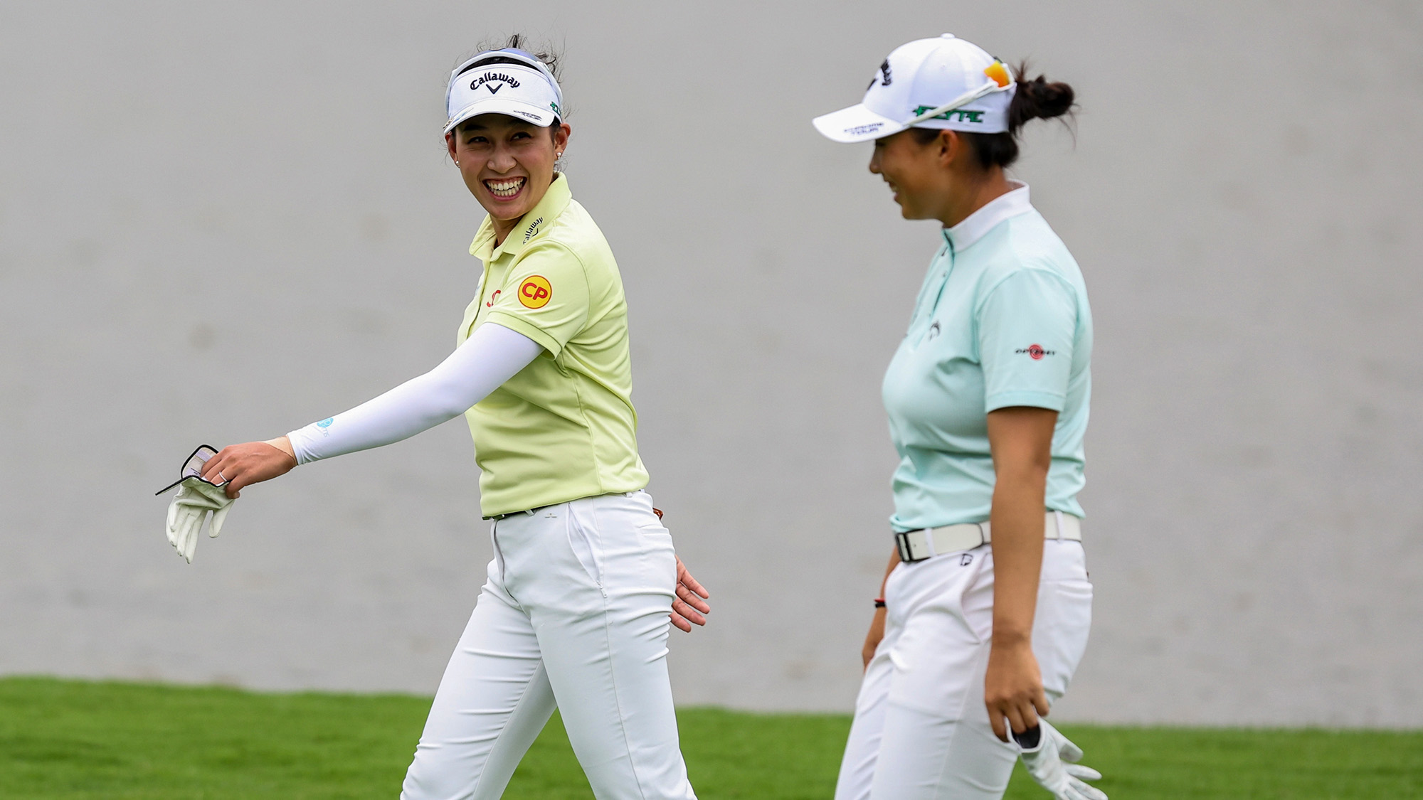 Jeeno Thitikul (L) of Thailand and Ruoning Yin of China react on 8th hole during the first round of the Blue Bay LPGA 2025 at Jian Lake Blue Bay Golf Course on March 06, 2025 in Hainan Island, China.