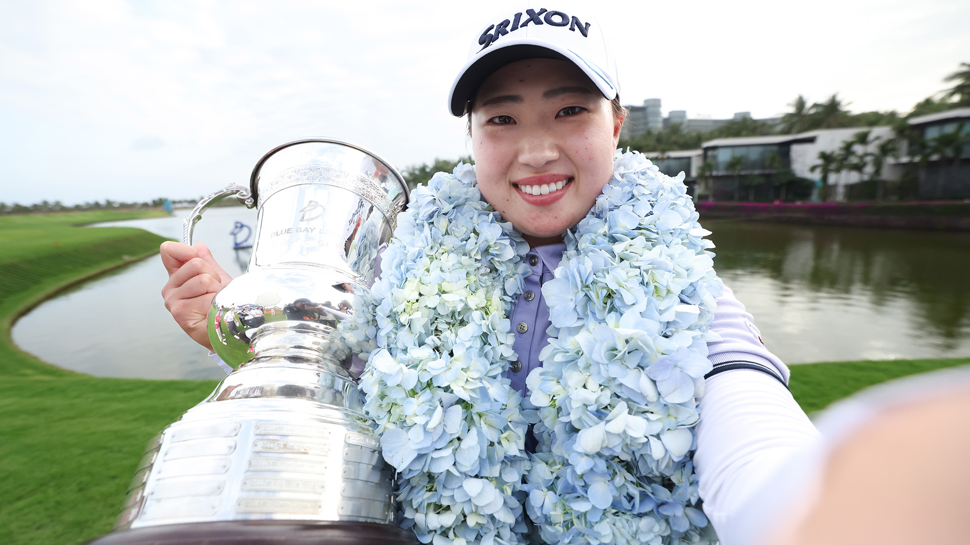 Rio Takeda of Japan imitates a “selfie” as she poses with the trophy after winning the final round of the Blue Bay LPGA 2025 at Jian Lake Blue Bay Golf Course on March 09, 2025 in Hainan Island, China.