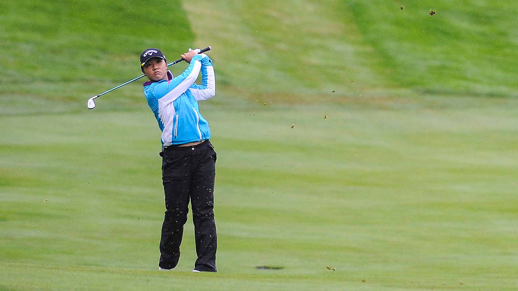 Lydia Ko of New Zealand takes her second shot on the 16th hole during the first round of the Canadian Pacific Women's Open at Priddis Greens Golf and Country Club