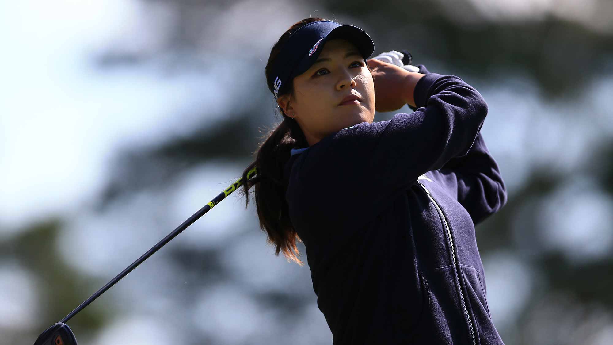  In Gee Chun of Korea watches her drive on the 9th hole during round one of the Canadian Pacific Women's Open at the Ottawa Hunt & Golf Club