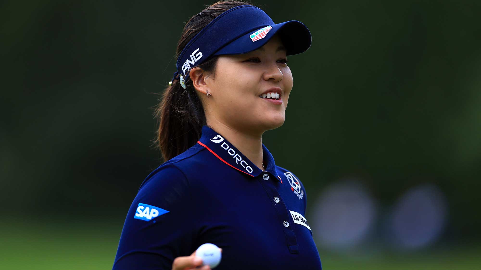 In Gee Chun of South Korea reacts after sinking a putt on the 3rd green during the final round of the Canadian Pacific Women's Open