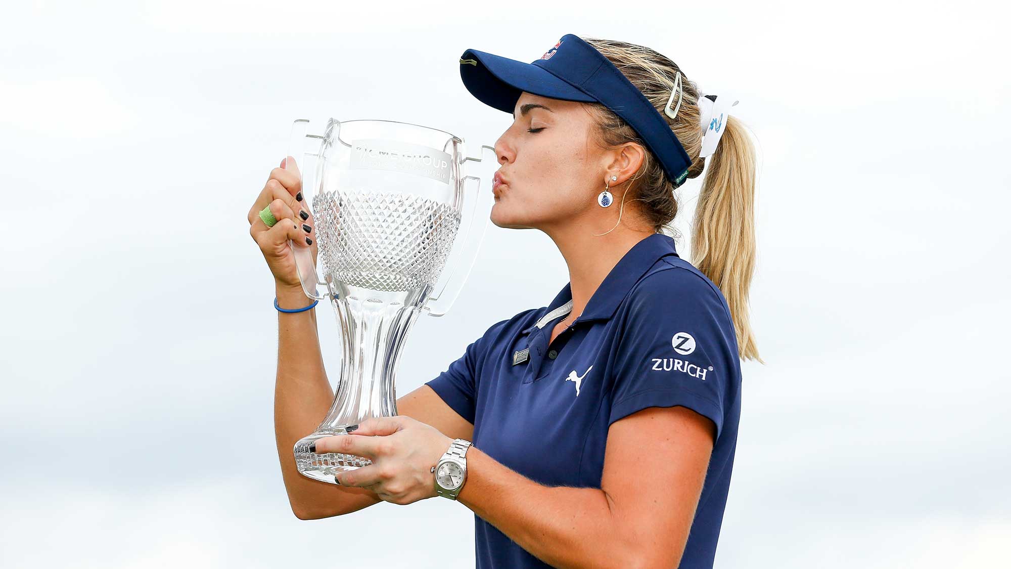 Lexi Thompson poses for a photo with the CME Group Tour Championship trophy