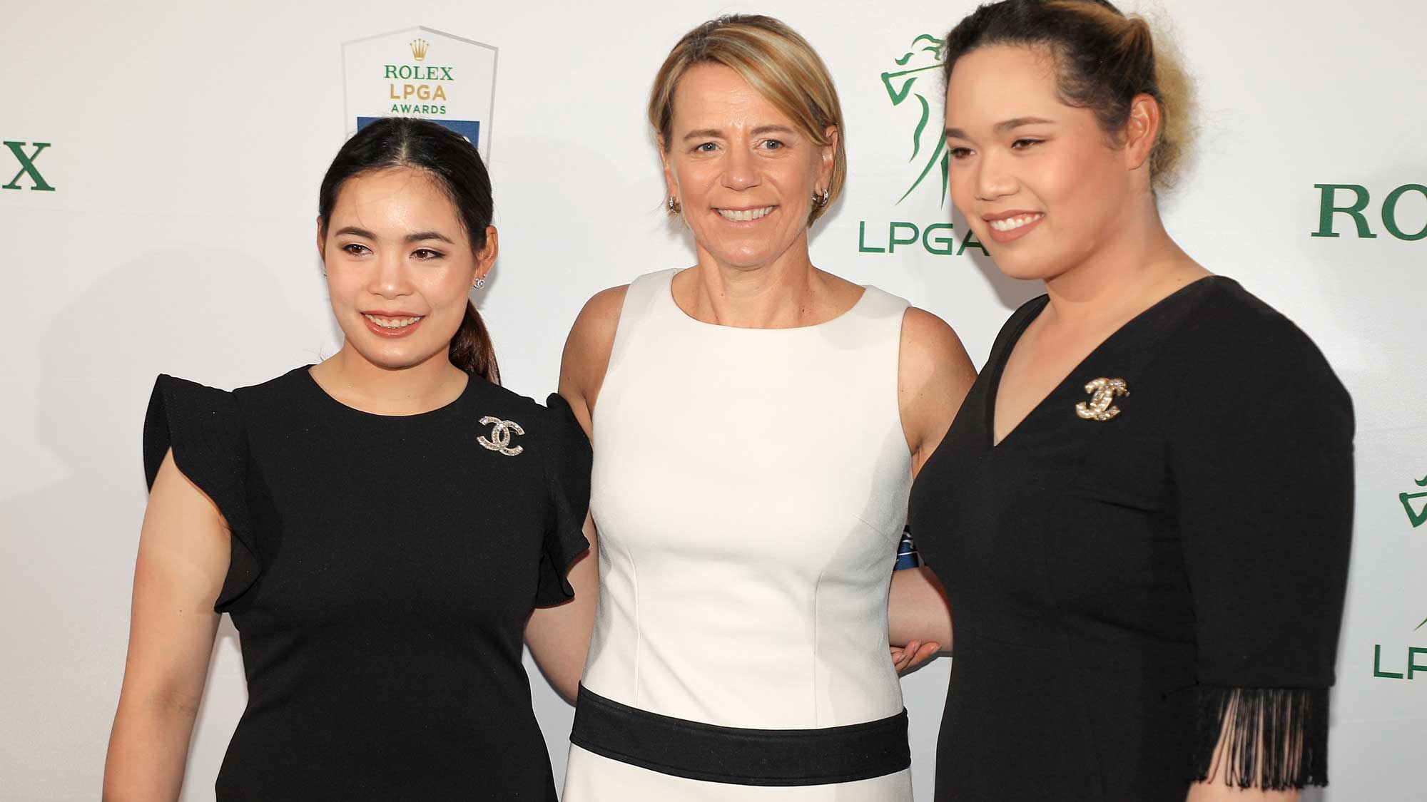 Moriya Jutanugarn (left) and Ariya Jutanugarn of Thailand pose for a photo with former LPGA golfer Annika Sorenstam on the green carpet during the LPGA Rolex Players Awards at the Ritz-Carlton Golf Resort