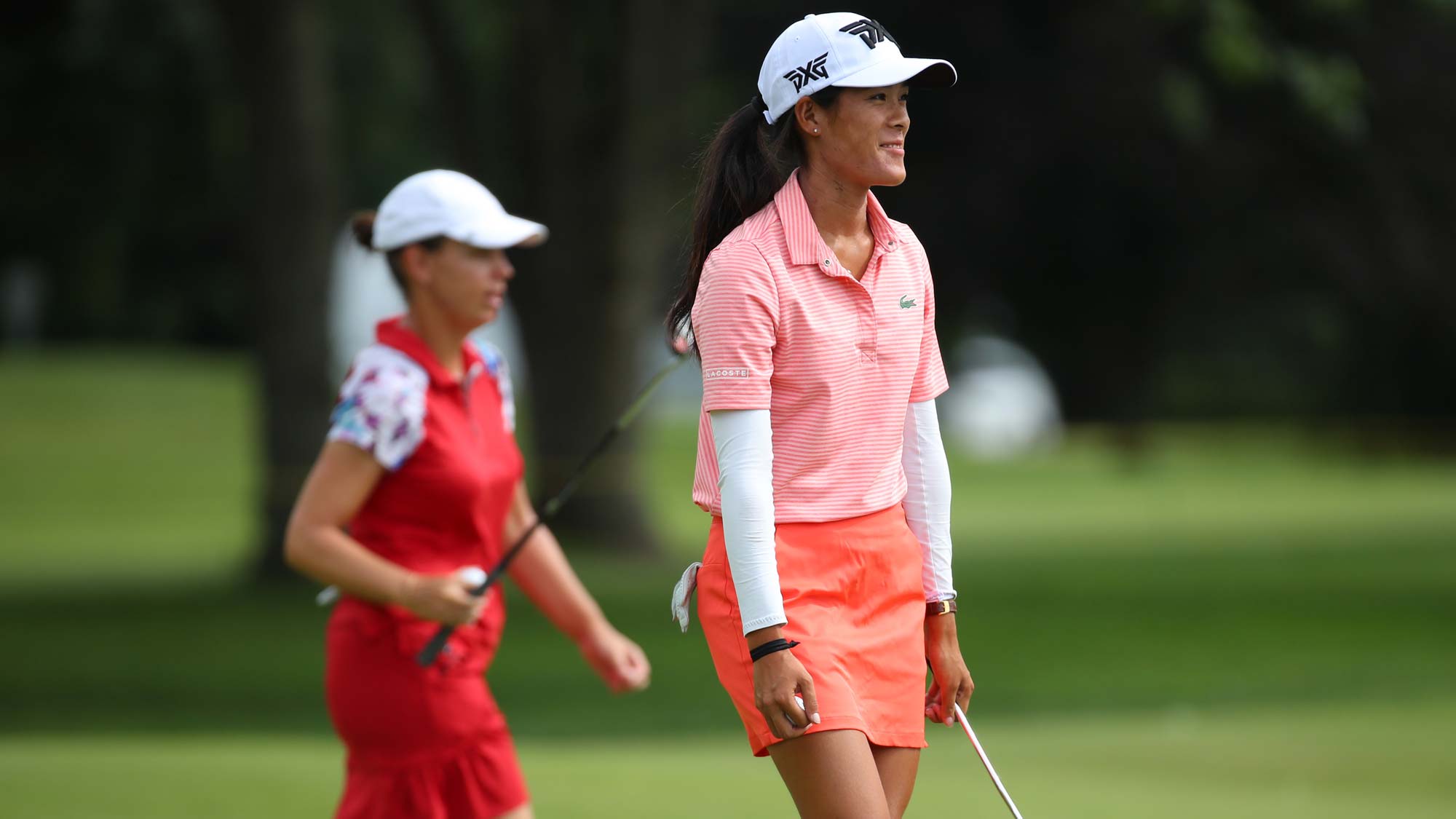 Teammates Karine Icher (L) and Celine Boutier of France walk off the 17th green during round two of the Dow Great Lakes Bay Invitational 