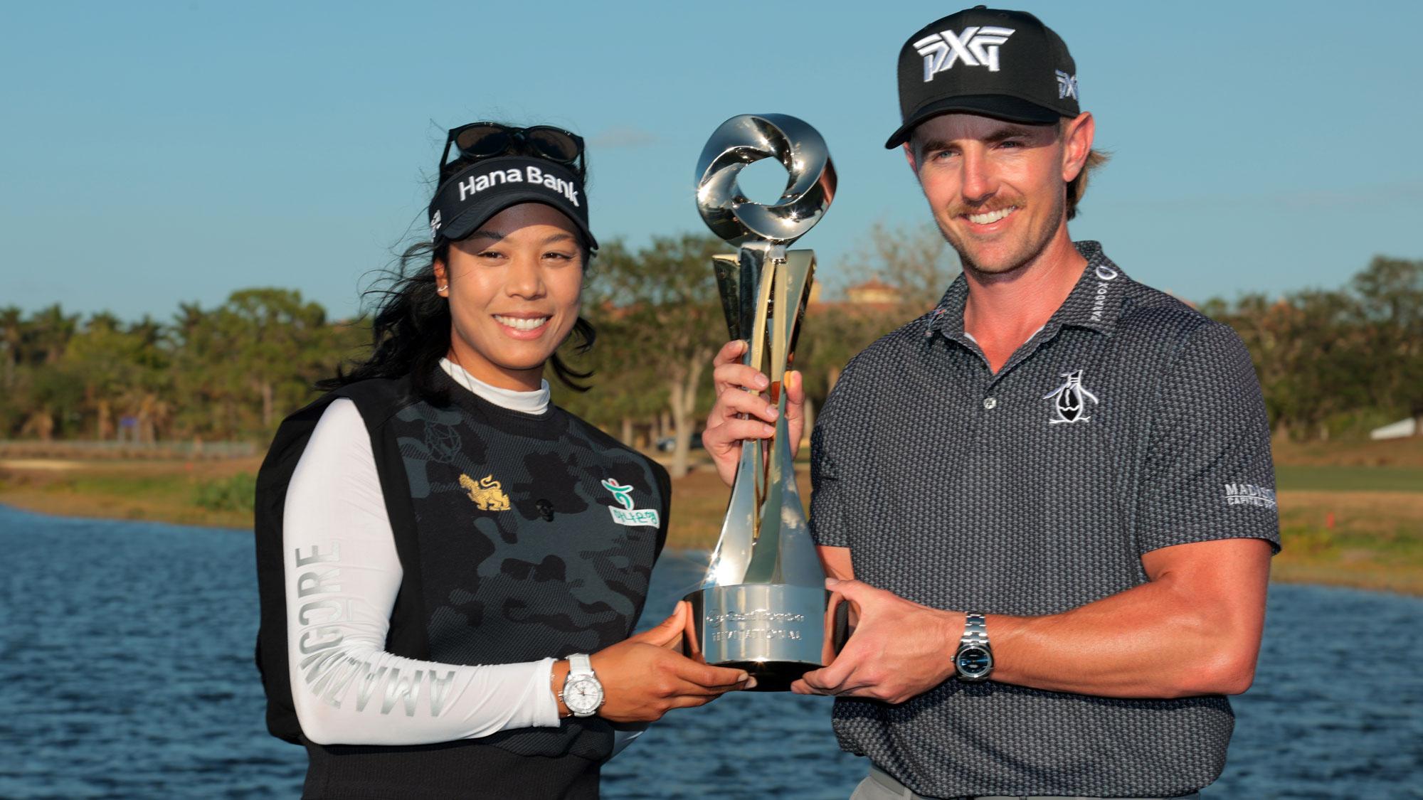  Patty Tavatanakit of Thailand and Jake Knapp of the United States pose with the trophy after putting in to win on the 18th green during the final round of the Grant Thornton Invitational 2024 at Tiburon Golf Club on December 15, 2024 in Naples, Florida.