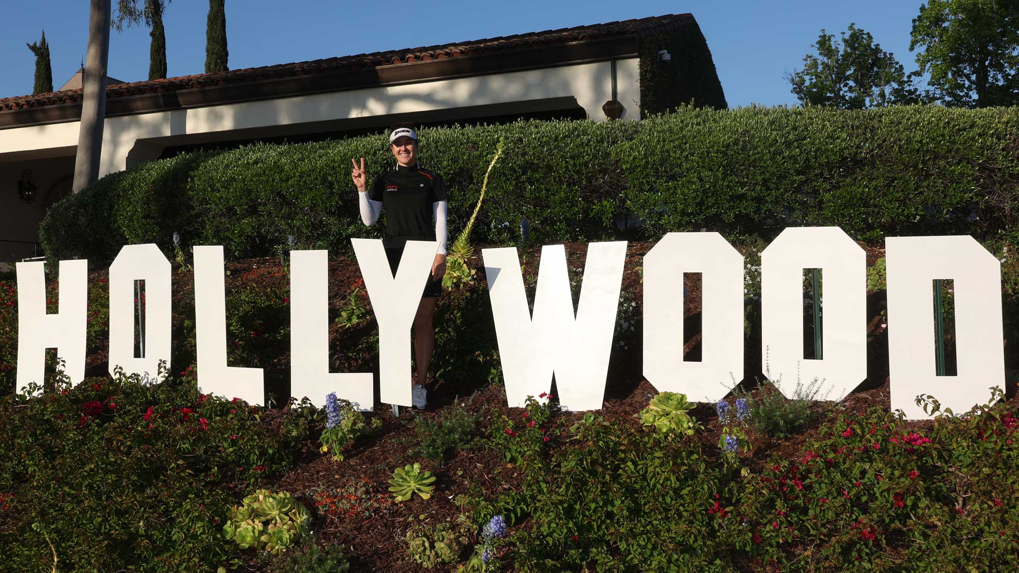 Hannah Green of Australia poses behind a Hollywood sign after winning the JM Eagle LA Championship presented by Plastpro at Wilshire Country Club on April 28, 2024 in Los Angeles, California.