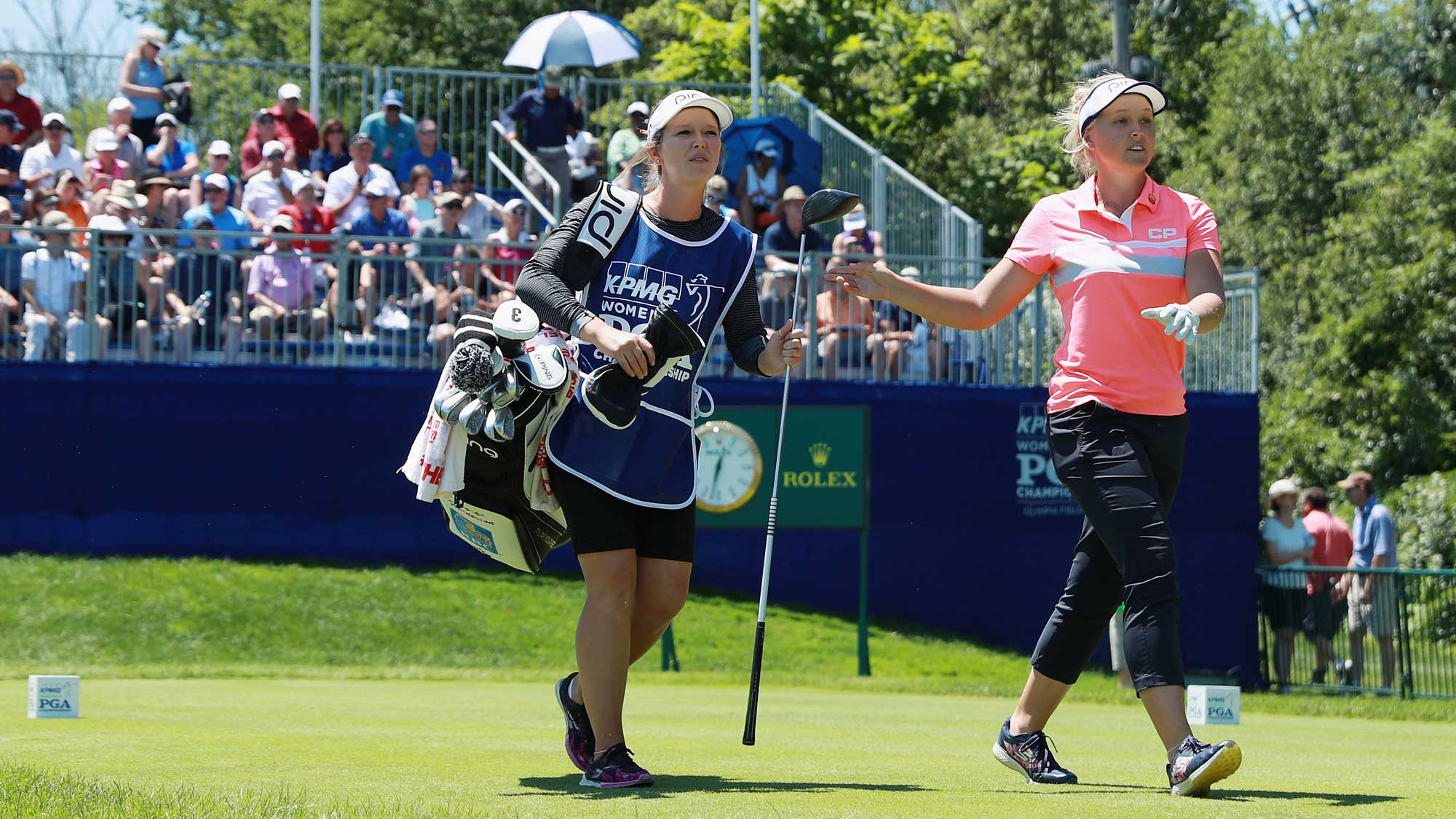 Brooke Henderson of Canada walks off the first tee alongside her sister/caddie Brittany during the final round of the 2017 KPMG Women's PGA Championship