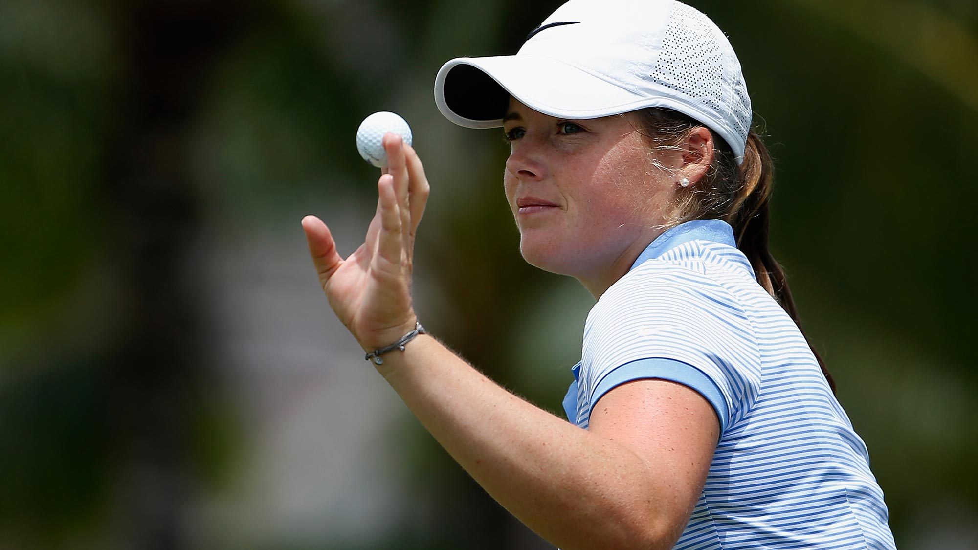 rooke Henderson of Canada reacts to a par putt on the fourth green during the third round of the LPGA LOTTE Championship