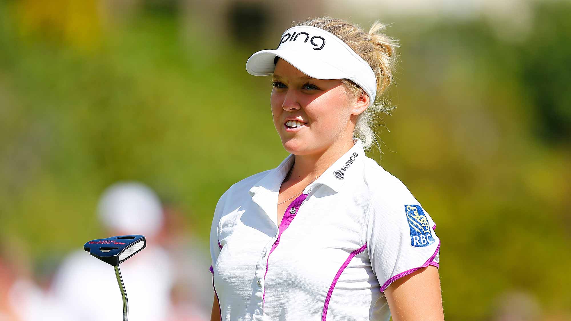 Brooke M. Henderson of Canada smiles on the 18th hole after shooting 18 under par for the tournament during the third round of the LPGA Cambia Portland Classic at Columbia Edgewater Country Club