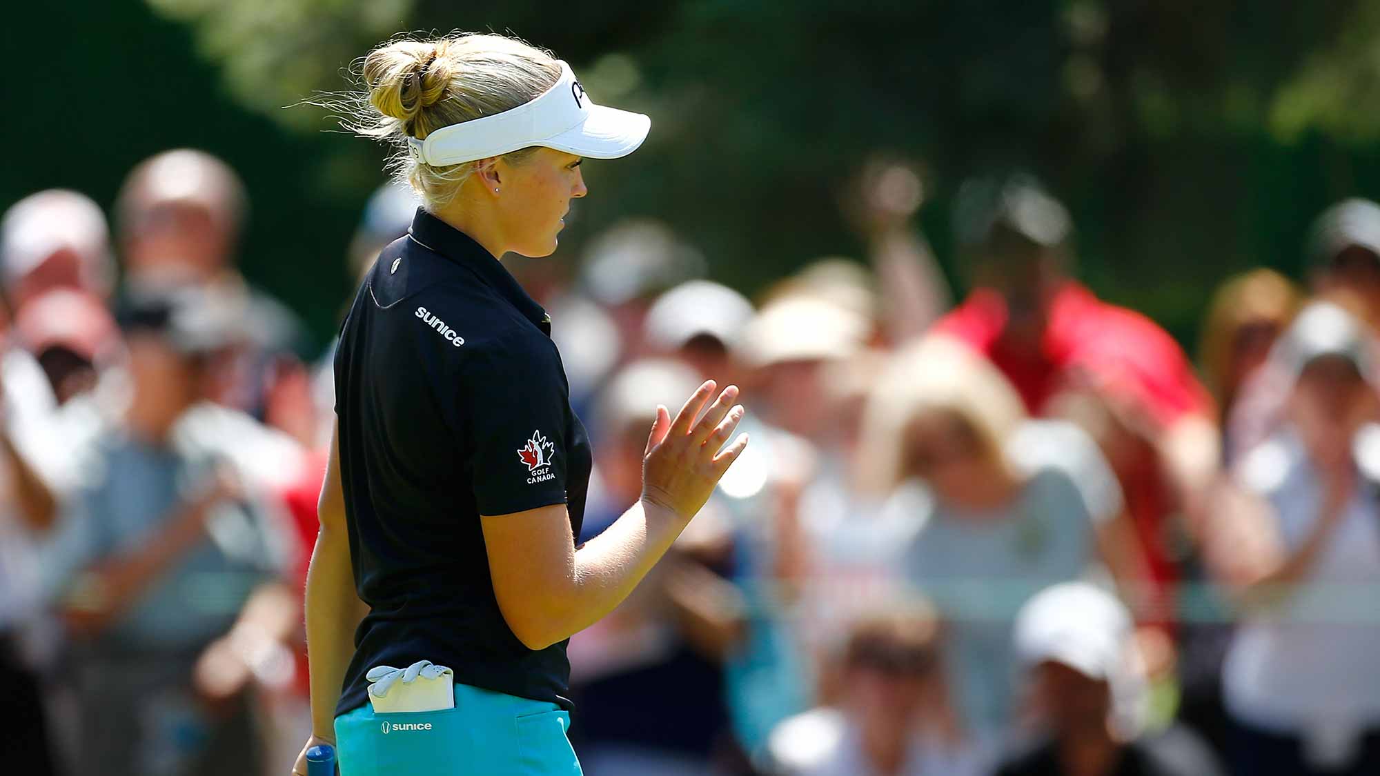 Brooke Henderson of Canada waves to the crowd after making a birdie putt on the 9th hole during the final round of the LPGA Cambia Portland Classic at Columbia Edgewater Country Club