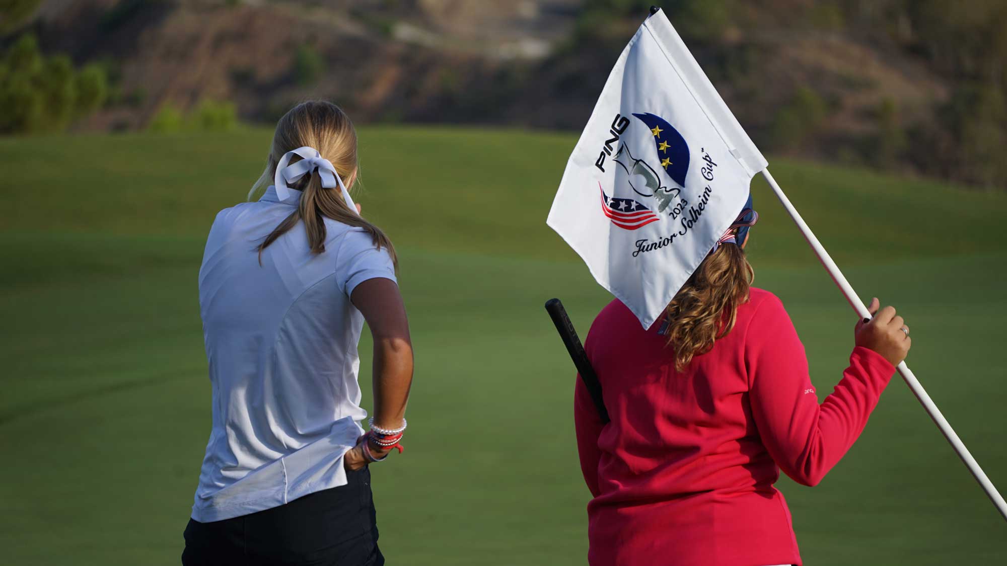 rudisill-and-knaub-with-pjsc-flag---2023---ping-junior-solheim-cup_2000x1125.jpg