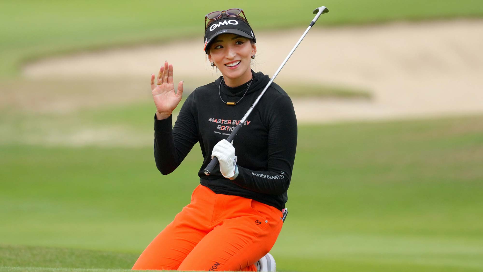 Hana Wakimoto of Japan acknowledges the gallery after the chip-in-birdie on the 9th hole during the first round of the TOTO Japan Classic 2024 at Seta Golf Course