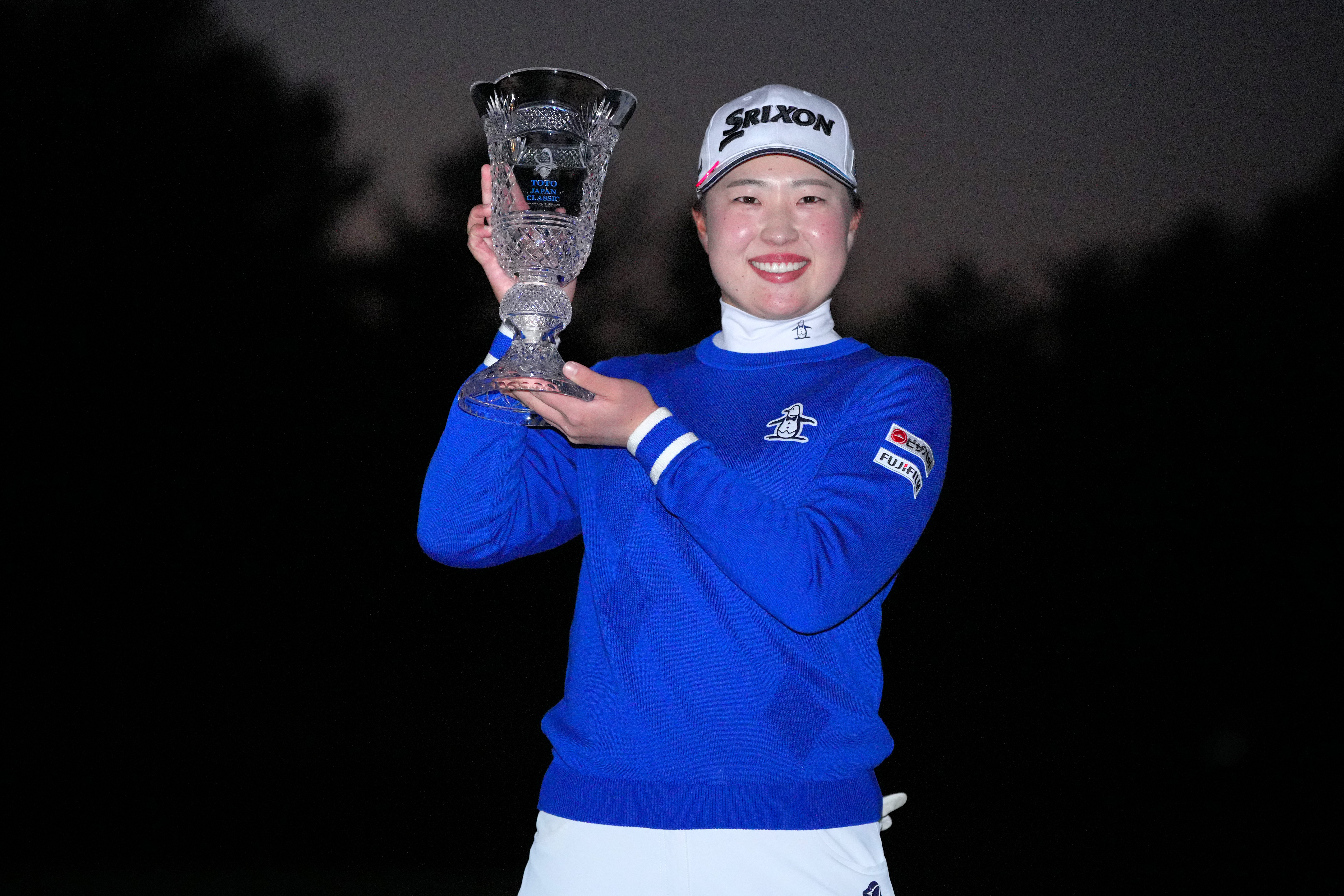 Rio Takeda of Japan poses with the trophy after winning the tournament following the final round of the TOTO Japan Classic 2024 at Seta Golf Course on November 3, 2024 in Otsu, Shiga, Japan.