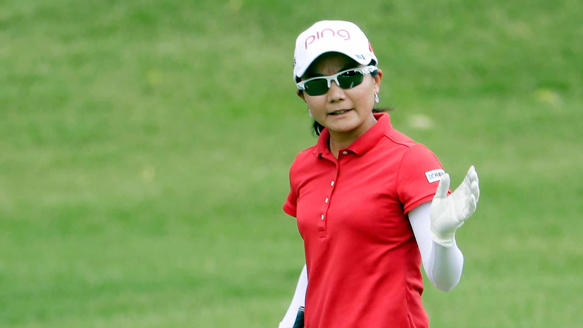 Ayako Uehara of Japan waves after hitting her second shot on the 9th hole during the first round of the Walmart NW Arkansas Championship Presented by P&G